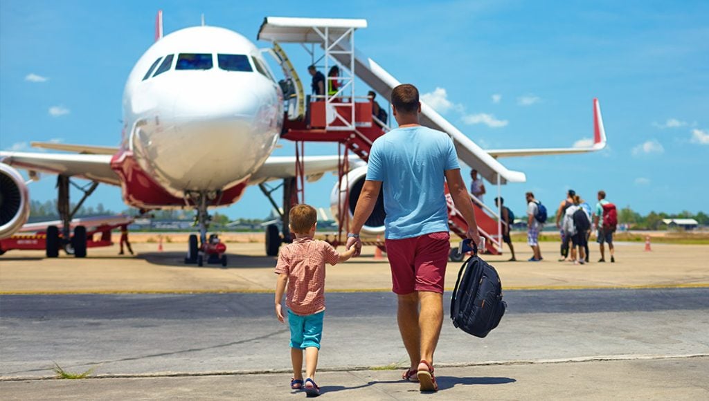 Travelers boarding their flight