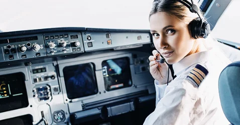 Female airline pilot in the cockpit