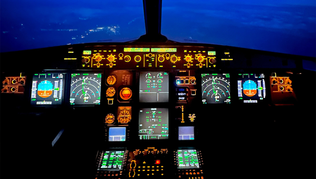 Airline pilot cockpit at night