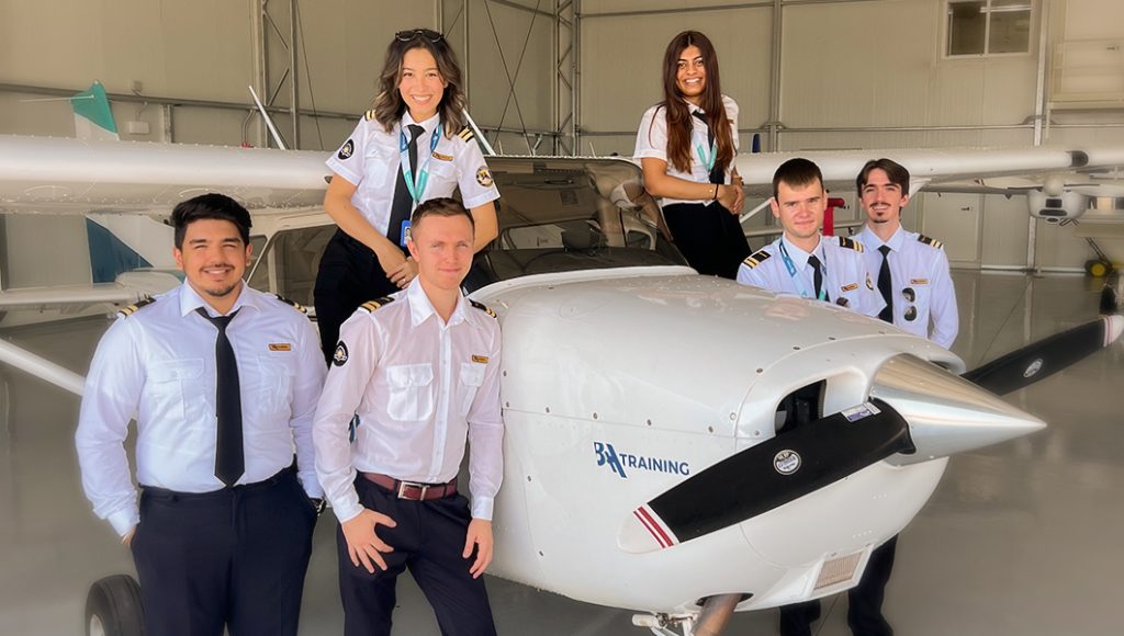 BAA Training flight school students next to Cessna 172 Skyhawk