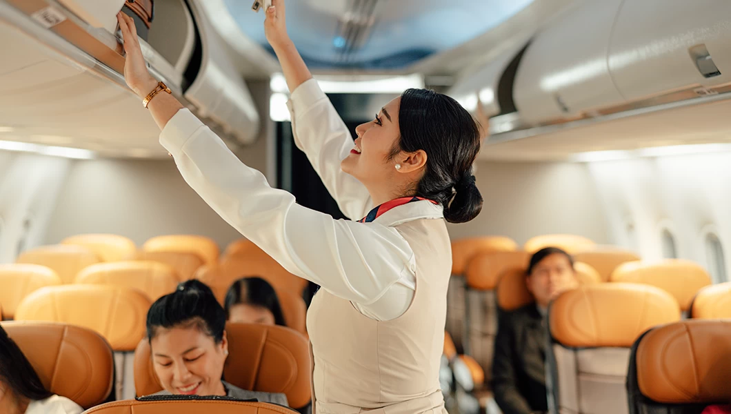 Flight attendant in an aircraft.