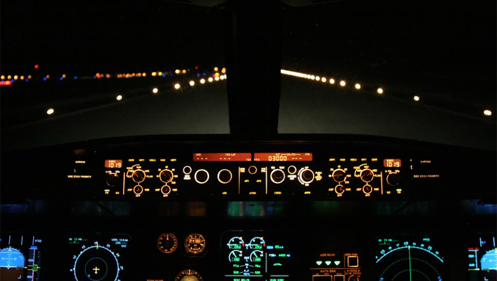 taxiway ground lights at night from a cockpit