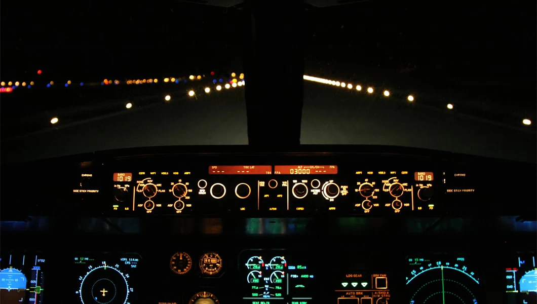 taxiway ground lights at night from a cockpit