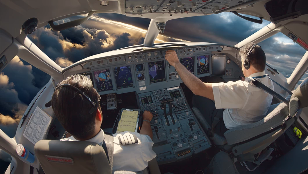 Two pilots in a aircraft cockpit, difficult weather conditions