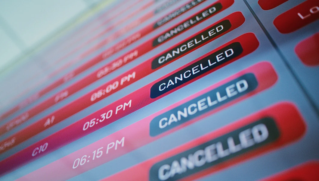 A departures board with cancelled flights information