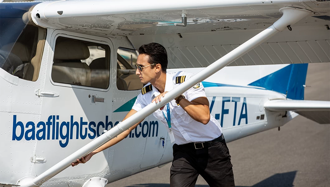 A student pilot getting ready for his solo flight