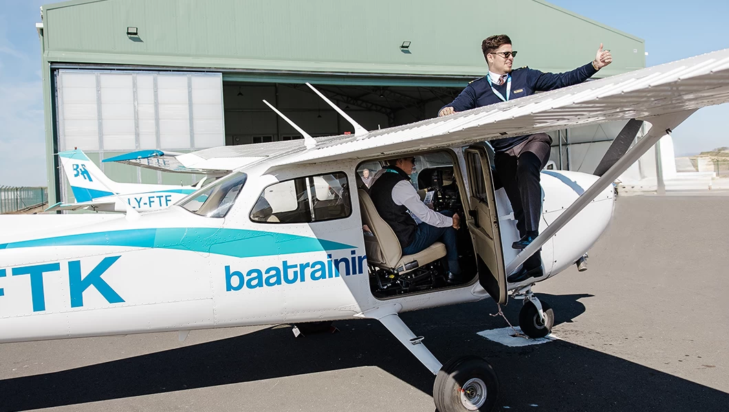 Student pilot and Flight Instructor preparing for flight on Cessna 172 Skyhawk